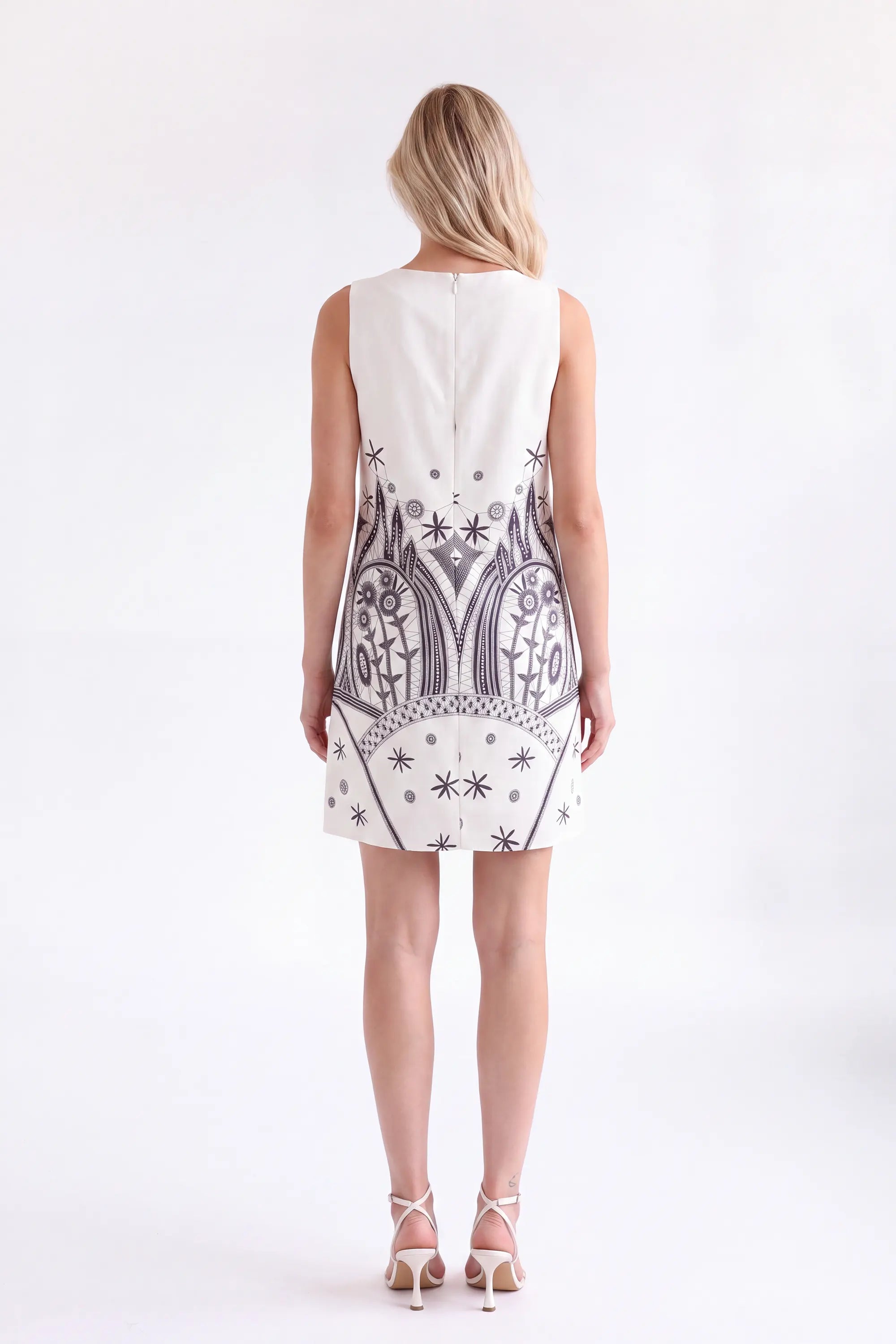 Off-White Sleeveless Shift Dress with Black Ethnic Pattern — Model White Background View 5