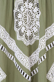 White crochet lace appliqué detail on olive green Elppis maxi dress