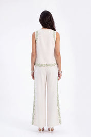 Beige Sleeveless Top with Green Embroidery on model, back view – Elppis UV3D9796F