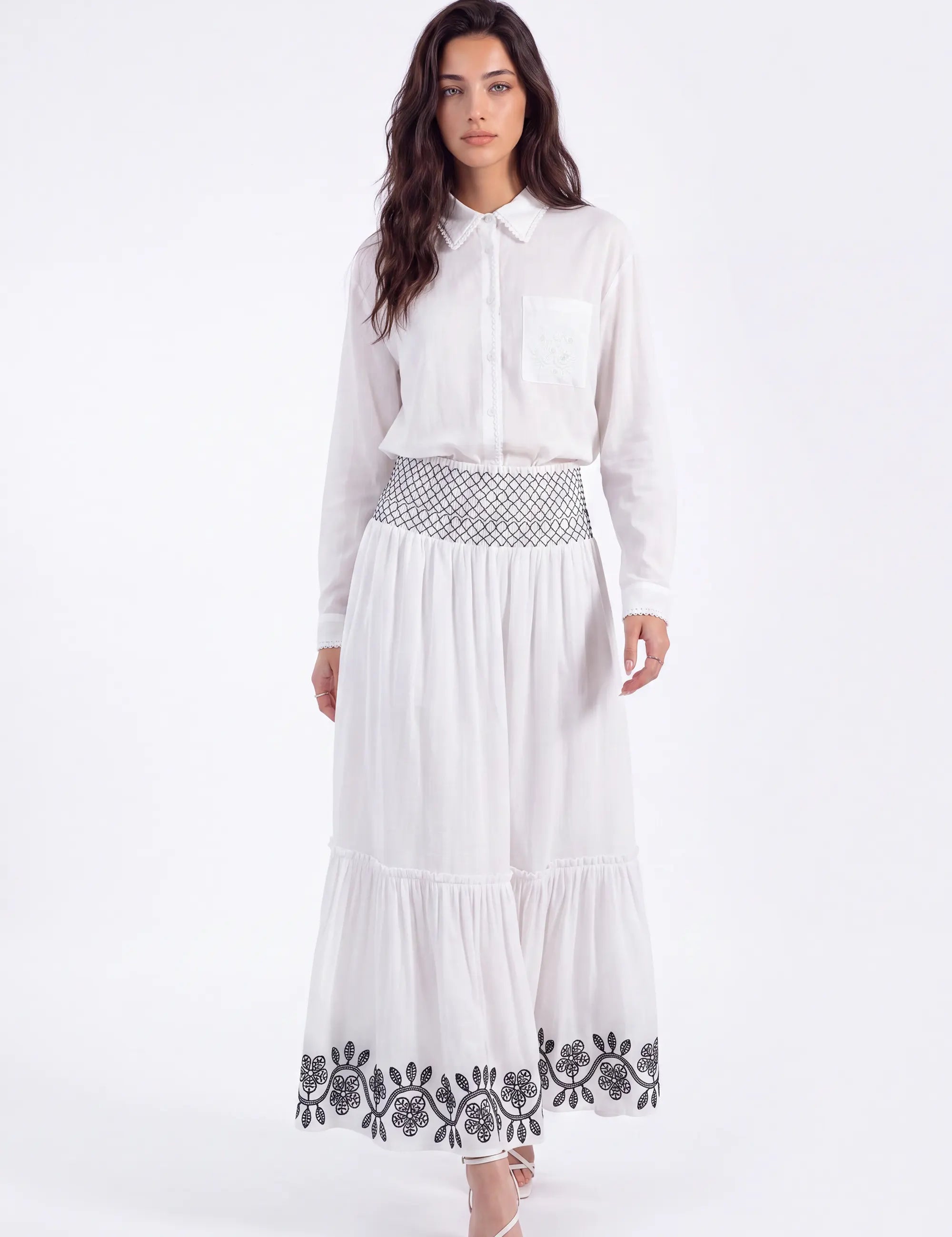 White Maxi Skirt with Black Geometric and Floral Embroidery on model, front view – Elppis UV3J9324F-1-F