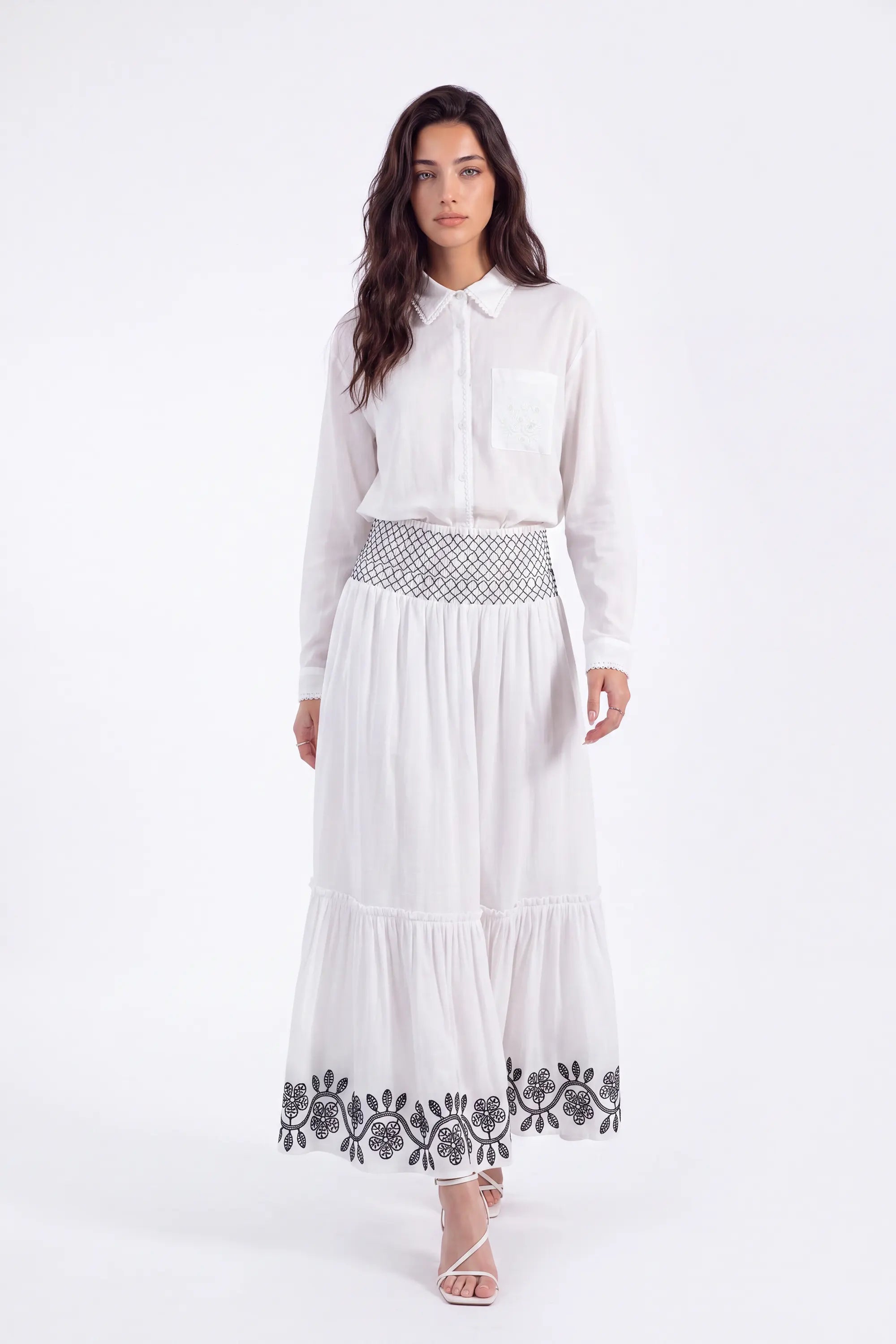 White Maxi Skirt with Black Geometric and Floral Embroidery on model, front view – Elppis UV3J9324F-1-F