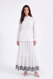 White Maxi Skirt with Black Geometric and Floral Embroidery on model, studio view 2 – Elppis UV3J9324F-1-F