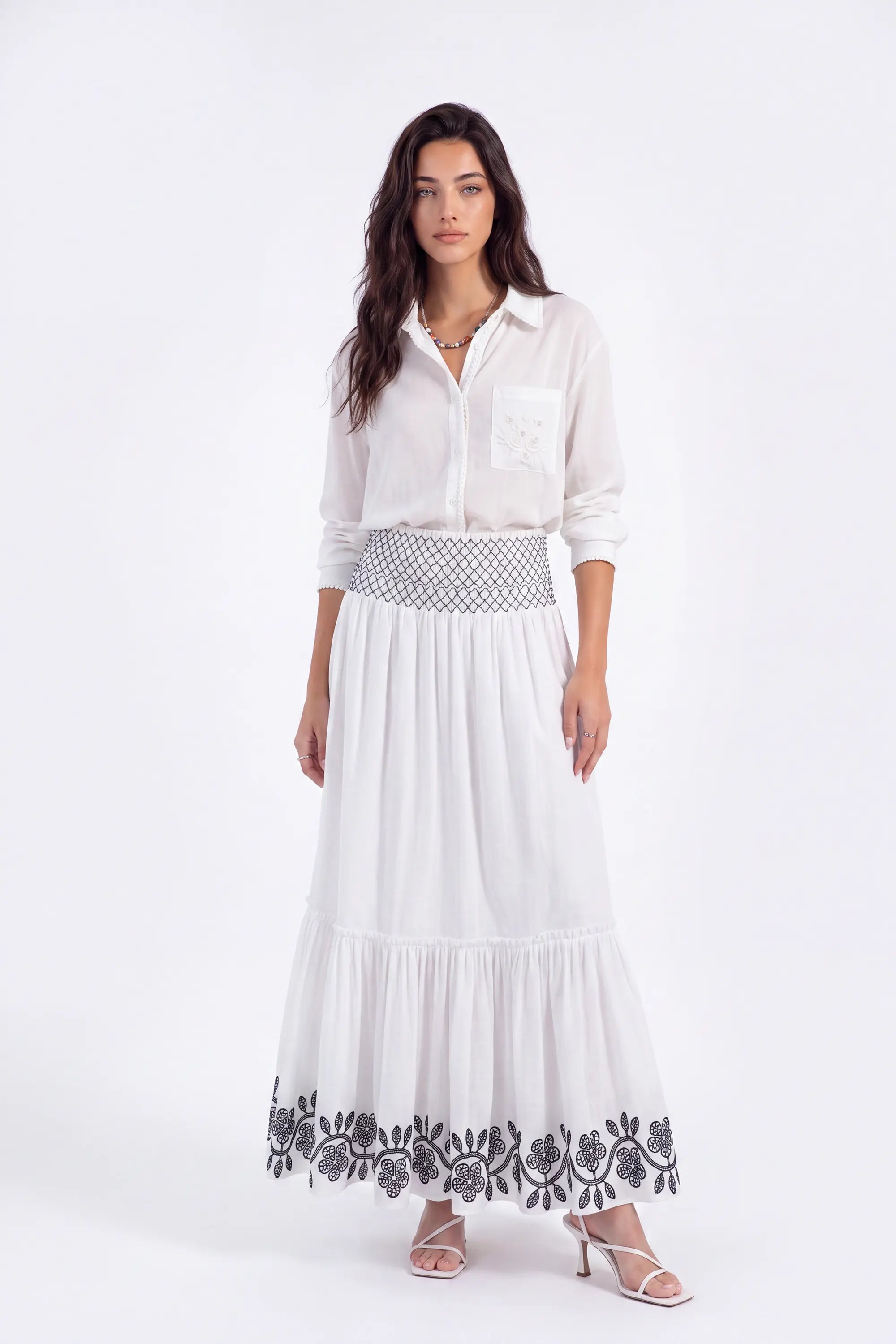 White Maxi Skirt with Black Geometric and Floral Embroidery on model, studio view 3 – Elppis UV3J9324F-1-F