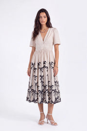 Beige Linen-Blend Midi Dress with Black Palm Tree Print on model, studio view 4 – Elppis UV3K9494F-2-F-01BS