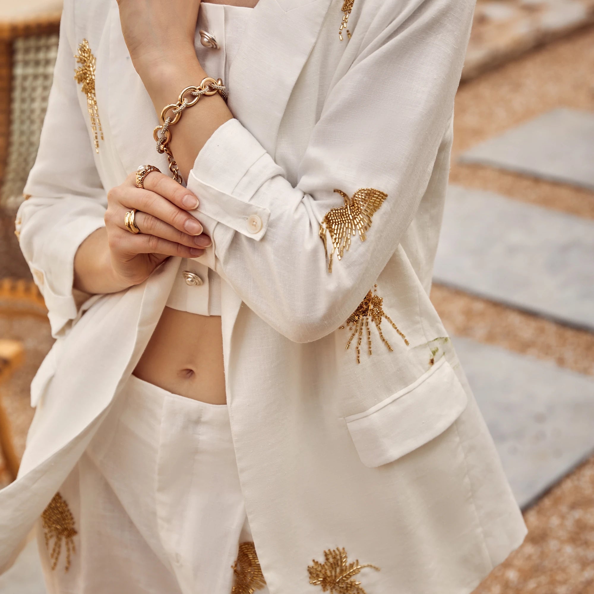 Elppis White Blazer with Gold Sequin Floral Embellishments, editorial styling view on model — SKU JD4W6708BO