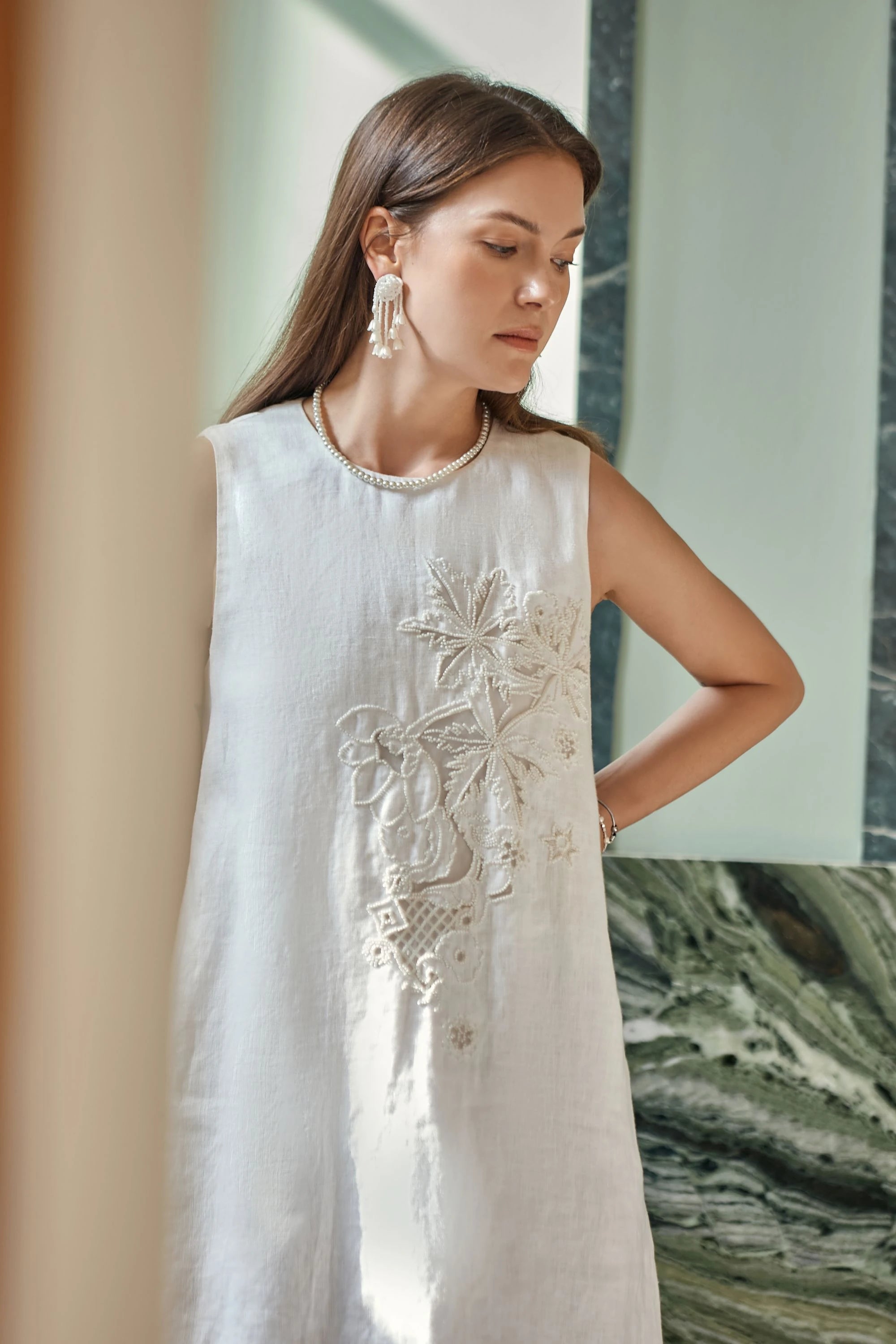 Elppis White Linen Sleeveless Beaded Embroidery Dress, editorial styling view on model — SKU JD4K6946BN
