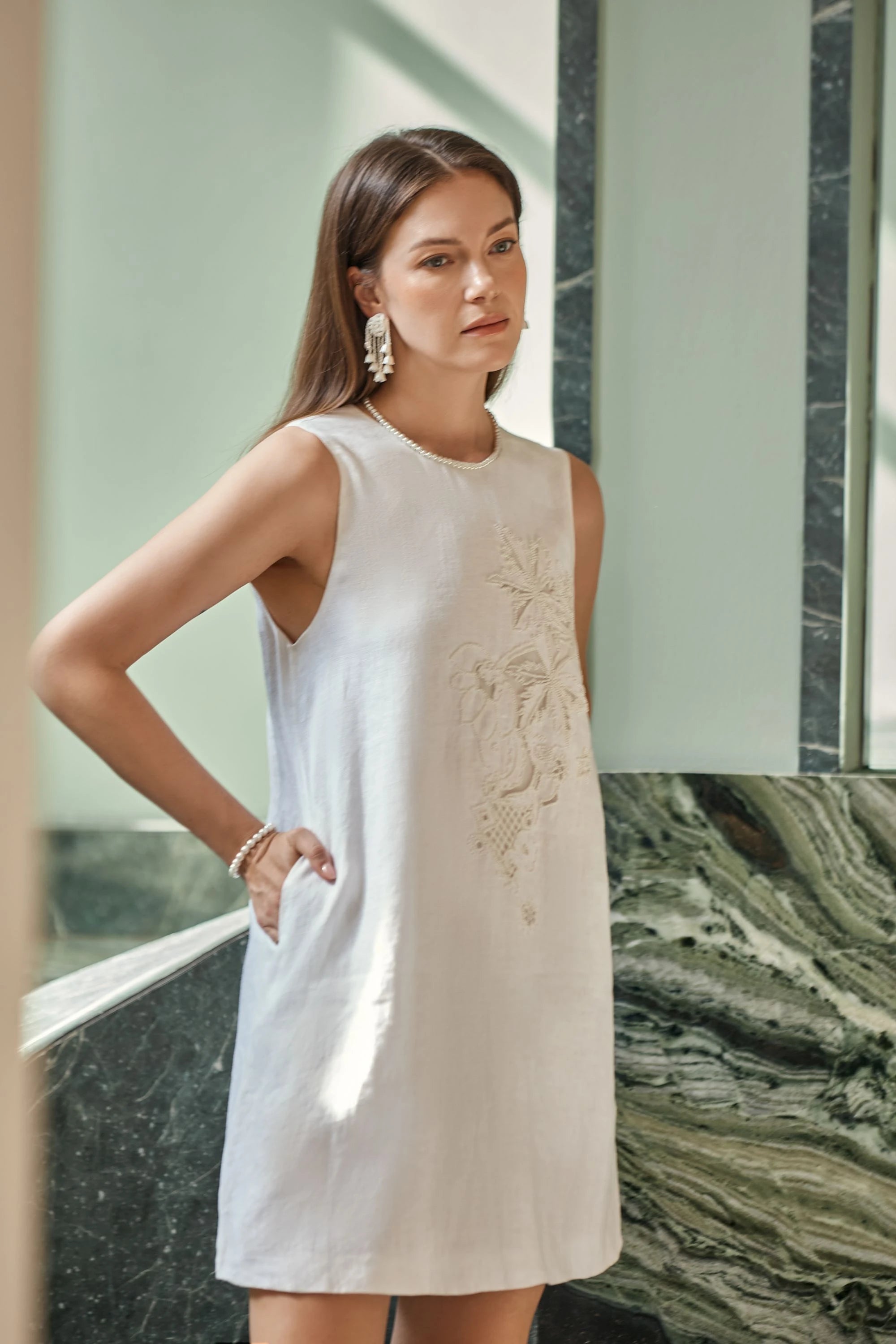 Elppis White Linen Sleeveless Beaded Embroidery Dress, editorial styling view on model — SKU JD4K6946BN