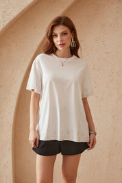 Elppis White Oversized T-Shirt with Gradient Rhinestone Dot Embellishments, editorial styling view on model — SKU 3B5E04542WW