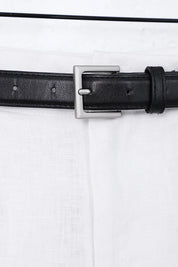 White Polyester High-Waisted Shorts with Rolled Hem and Leather Belt — Model White Background View 2