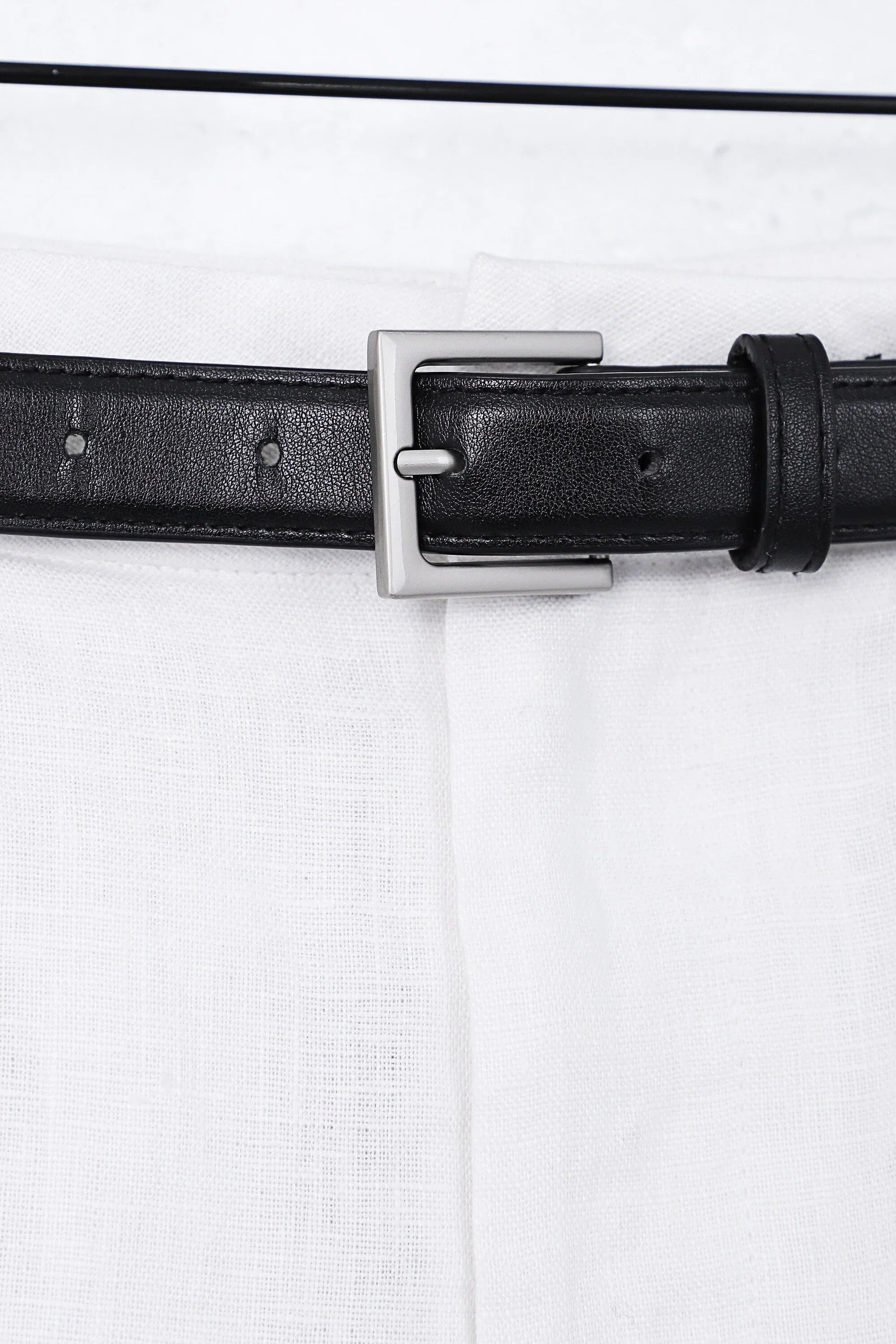 White Polyester High-Waisted Shorts with Rolled Hem and Leather Belt — Model White Background View 2