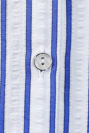 White Polyester High-Waisted Shorts with Rolled Hem and Leather Belt — Model White Background View 3