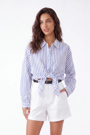 White Polyester High-Waisted Shorts with Rolled Hem and Leather Belt — Model White Background View 4