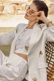 Elppis White Polyester Wide-Leg Pants with Gold Crane Embroidery, editorial styling view on model — SKU JD4I6657BO