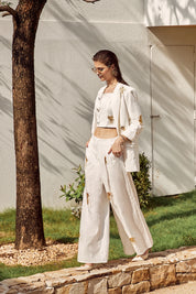 Elppis White Polyester Wide-Leg Pants with Gold Crane Embroidery, editorial styling view on model — SKU JD4I6657BO