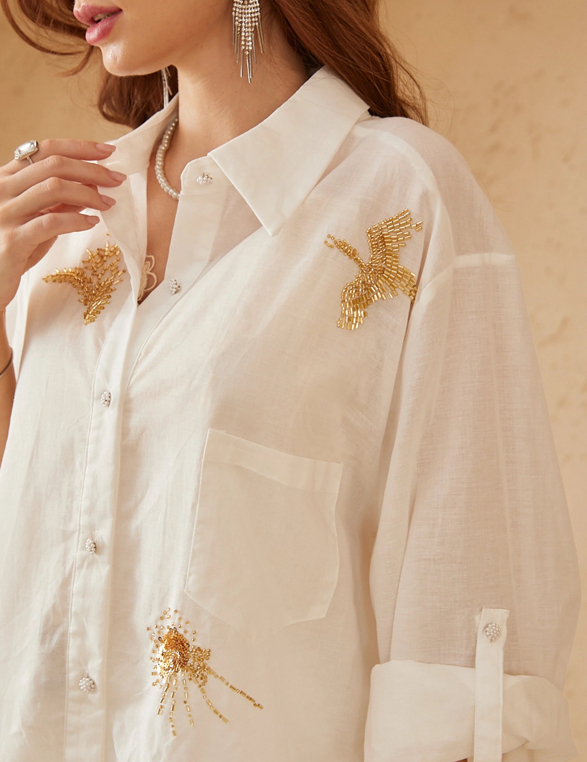 Elppis White Ramie-Cotton Blend Shirt with Gold Crane Bead Embroidery, editorial styling view on model — SKU JD4F6669BO