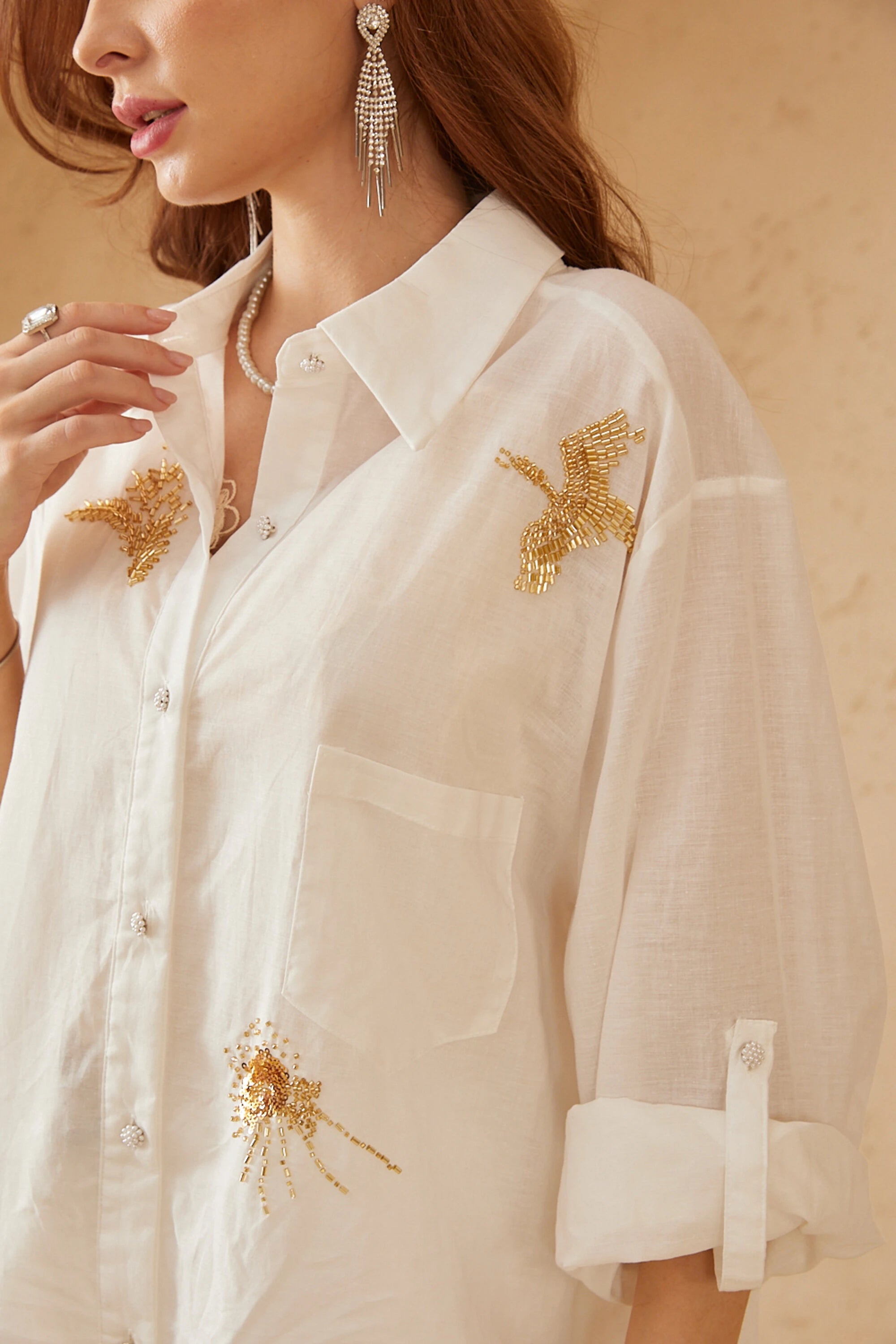 Elppis White Ramie-Cotton Blend Shirt with Gold Crane Bead Embroidery, editorial styling view on model — SKU JD4F6669BO