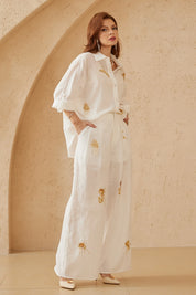 Elppis White Ramie-Cotton Blend Shirt with Gold Crane Bead Embroidery, editorial styling view on model — SKU JD4F6669BO